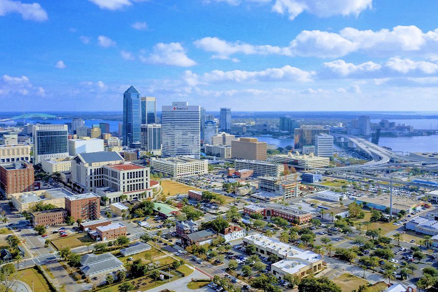 Contact - Aerial View of Downtown Jacksonville Florida on a Bright Sunny Day With Blue skies